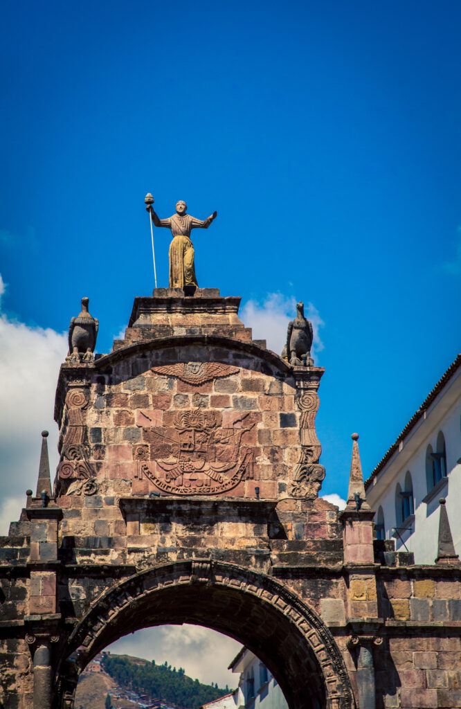 Ornate statues on the city gsate in cusco peru